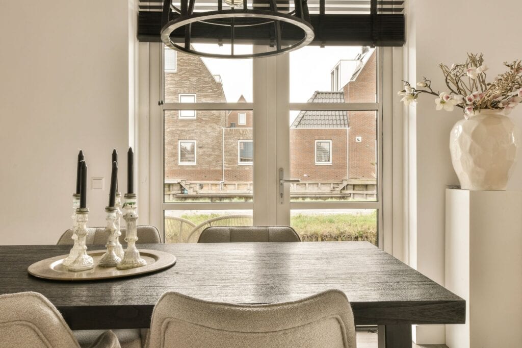 A dining room with large windows