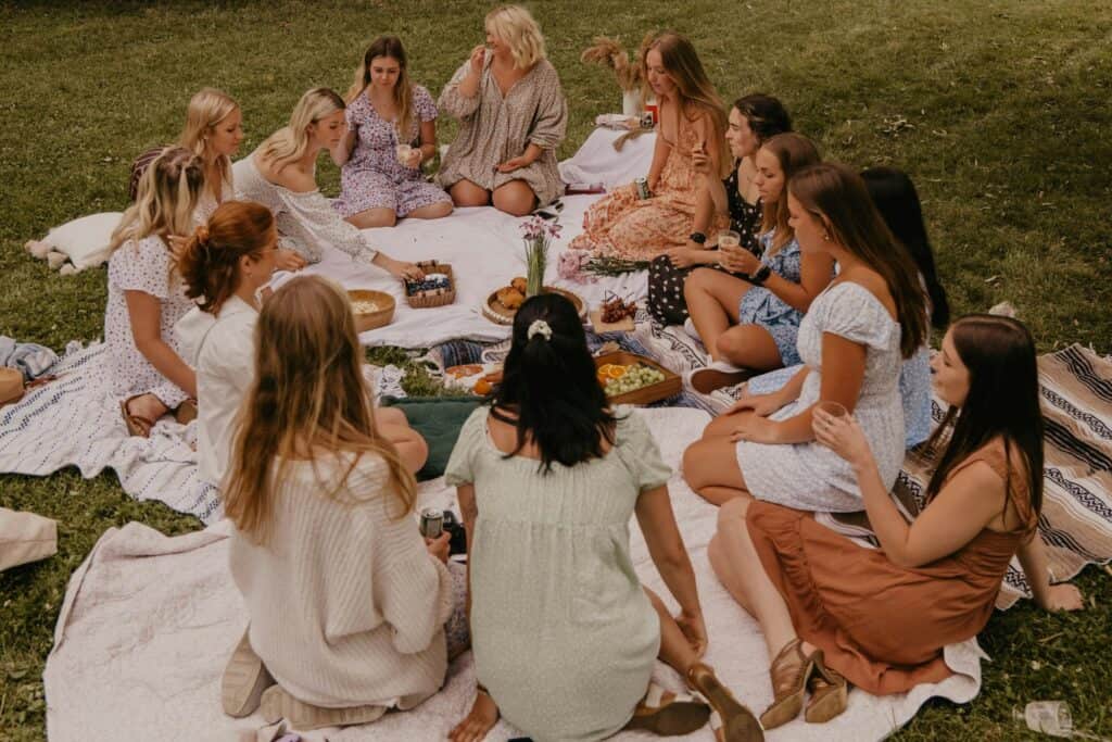 A group of women picnicking in a park