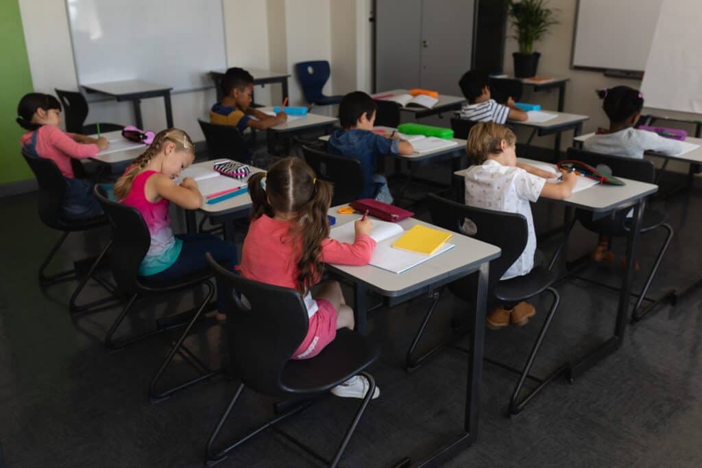 Young students studying in the classroom in the concept of top schools in Orpington.