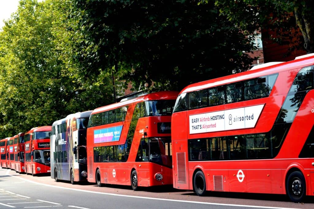 Parked double-deckers on the side of the road