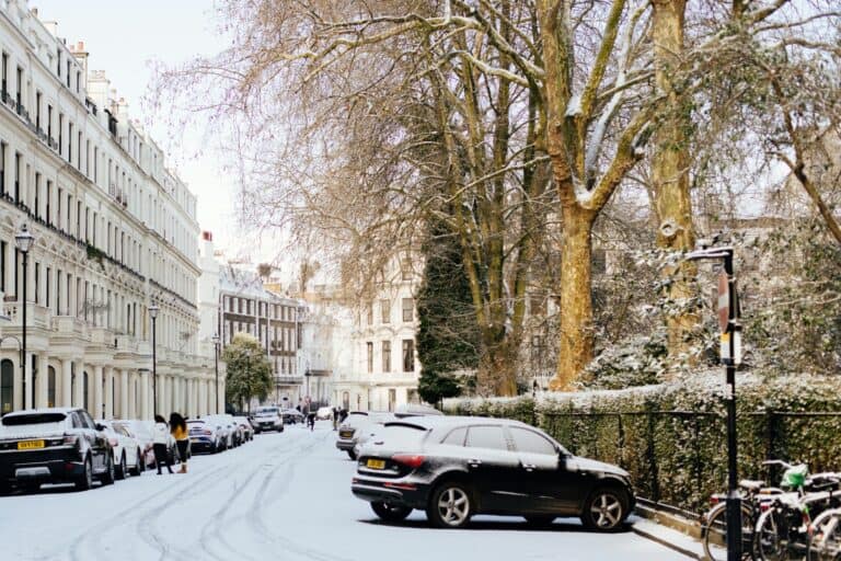 A row of townhouses covered in snow in the concept of 'best affordable housing options in Orpington'.